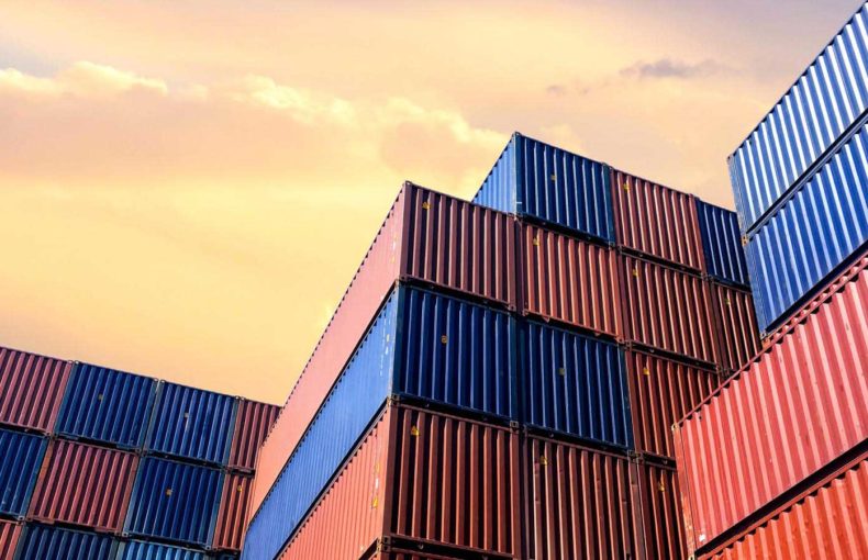 stacked shipping containers in port